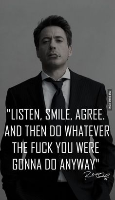 a man in a suit and tie with a quote on it