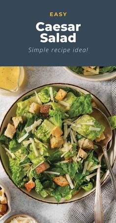 a salad with lettuce and croutons in it on top of a table