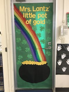 a door decorated with a pot of gold and a rainbow