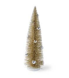 a small gold christmas tree with silver balls on it's branches and ornaments around the base