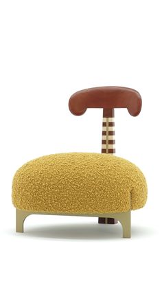 an upholstered chair with a wooden foot rest