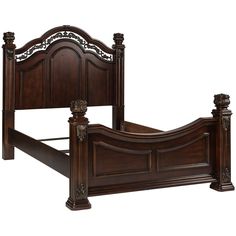 a wooden bed frame with ornate carvings on the headboard and foot board, made in dark wood