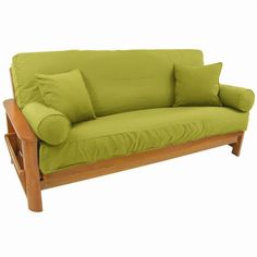 a green couch with two pillows on it's back and one arm folded down