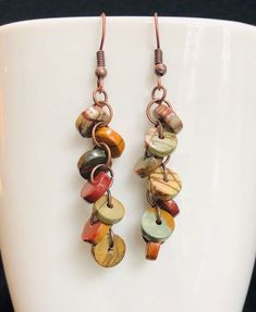 Picasso Jasper Copper Earrings - Boho Style earrings in earthy tones. Each pair is made individually, and each bead is unique! All pairs are different and may appear different than photo. Enjoy the true uniqueness of these beautiful Picasso Jasper Earrings! Brown Adjustable Earrings With Natural Stones, Unique Earrings With Round Natural Stones, Unique Brown Round Earrings, Handmade Jasper Earrings As Gift, Multicolor Earthy Dangle Earrings, Earthy Multicolor Dangle Earrings, Earthy Multicolor Earrings For Gift, Earthy Multicolor Earrings Perfect For Gifts, Artisan Brown Beaded Earrings For Pierced Ears