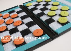 two checkers game with orange and black buttons