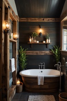 a bathroom with a bathtub and candles on the wall next to shelves filled with potted plants