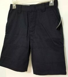 Boys size 12 Eddie Bauer navy blue school uniform shorts have a cell phone pocket.  Adjustable elastic tabs in waist.  Flat front. Zip and metal slide closure at front.  Two front slant side pockets, Cell phone pocket on right back side.  Two button back pockets.  Across the waist measures about 13.5 inches (adjust smaller with the button adjustment on the inside waistband).  Front rise about 11 inches.  Overall length about 18.5 inches.  Inseam about 8.5 inches. New with tags attached. We provi School Cotton Shorts With Pockets, Cotton School Shorts With Pockets, Navy Cotton School Bottoms, Navy Workwear Shorts With Pockets, Navy Shorts With Pockets For Work, Navy Cotton Bottoms For School, Navy School Bottoms With Pockets, Blue Workwear Shorts With Pockets, Navy Blue School Uniform