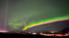 the aurora lights shine brightly in the night sky