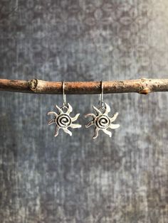 These whimsical silver boho dangle earrings feature little rustic silver plated sun charms hanging from nickel free iron ear wires. These are small, lightweight and perfect for those who prefer a minimalist style earring. Click on the link below if you'd like to see all of the earrings in my shop! https://www.etsy.com/shop/RiverviewMetalWorks Due to the nature of being handmade, no two pieces will look exactly the same and slight variations may occur. I try my best to accurately portray the deta Silver Forest Earrings, Boho Jewelry Earrings, Mountain Earrings, Random Clothes, Silver Chandelier Earrings, Earrings Nature, Dangle Earrings Boho, Op Shop, Nature Earrings