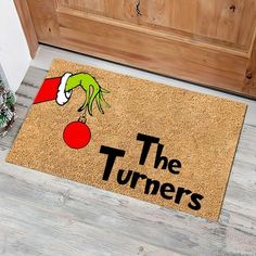 a door mat that says the turners on it with an elf's hat