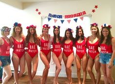 a group of women in bathing suits standing next to each other