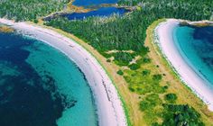 an aerial view of the ocean and land