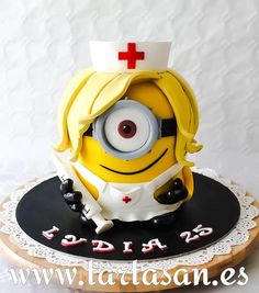 a cake made to look like a minion with a nurse's hat on top