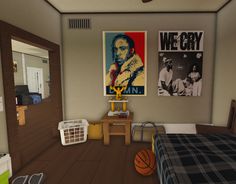 a bedroom with two posters on the wall