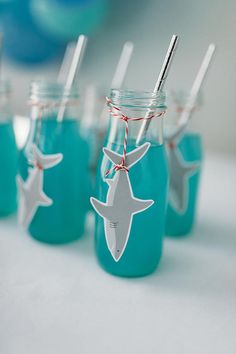 mason jars with toothbrushes in them are decorated with starfish tags and twine