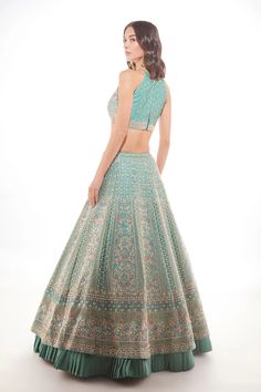 Green silk lehenga with fine glass beads, sequins, and pearls with a touch of resham embroidery paired with a halter blouse and net delicate scalloped dupattaFrom Chamee and Palak 's The Wedding Edit collection DELIVERY TIMEPlease allow 8-12 weeks for your outfit to arrive. FABRIC DETAILSSilk And Net Professional cleaning only. Green Silk Lehenga, Embroidered Bridal Lehenga, Wedding Edit, Resham Embroidery, Halter Blouse, Green Lehenga, Indian Wedding Wear, Silk Lehenga, Net Dupatta