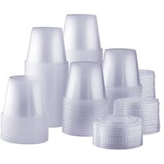 white plastic cups are stacked on top of each other