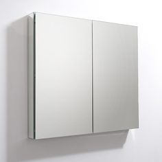 a mirror mounted on the side of a wall