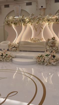 an elegant wedding setup with white flowers and greenery