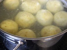 the food is being cooked in the pot on the stove