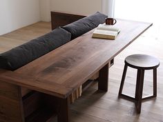 a couch and table in a room with wooden floors