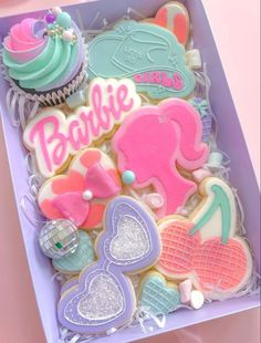 a box filled with lots of decorated cookies