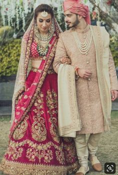 Luxurious Bridel Groom Dress In Red Lahnga Choli And Pinkish Sherwani.Bridal Lahnga Choli With Pure Dabka,Zari,Nagh,And, Threads Work.Groom Sherwani Based On Pure Jamawar Fabric In Light Pinkish Color. Bride Indian Wedding Outfits, Groom Indian Wedding Outfits, Shadi Dress, Sherwani Wedding, Bride Indian, Wedding Outfits For Groom, Groom Dress Men, Indian Groom Wear, Wedding Dresses Men Indian