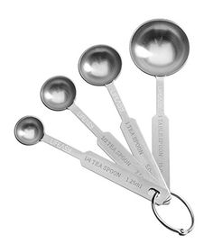 six measuring spoons with metal handles on white background