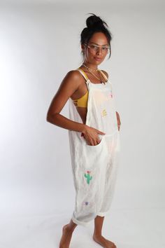 Get groovy by the pool with Romi Basha's Linen Jumpsuit! Hand embroidered and made with 100% linen, this jumpsuit features adjustable straps and front pockets. Perfect for pairing over your favorite swimsuit. Talk about a statement piece! Linen Jumpsuit, Designer Gifts, Romper With Skirt, Dress Romper, The Pool, Sweater Accessories, Beach Day, Summer Collection, Good Vibes