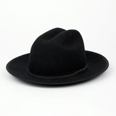 Our newest release is a hard wool style that also features a brand new crown shape. This Cattleman crown shape on our Field Fedora is a throwback to classic American headwear. A 2 3/4" flange up brim with brim binding. All leather is manufactured in a solar and wind powered facility that collects 27,300 tons of rainwater per year, and uses 50% natural light energy. Fit: Due to the stiff/firm nature of our hard wool, we recommend to check your head shape on our online fit guide below. The Field F Black Fedora With Flat Crown For Fall, Classic Fedora With Flat Crown, Classic Fur Felt Hat Band With Flat Crown, Classic Black Flat Brim Fedora, Classic Top Hat With Flat Crown For Fall, Classic Flat Crown Hat Bands For Fall, Classic Fall Top Hat With Flat Crown, Classic Flat Crown Top Hat For Fall, Classic Brimmed Hat For Town