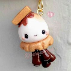 a cute little charm with some kind of food on it