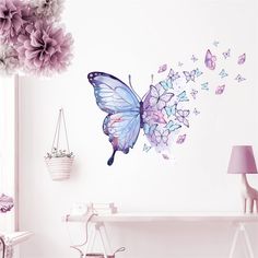 a butterfly wall decal with purple flowers and butterflies flying around it's wings