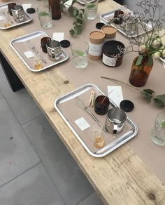 the table is set with empty glasses and silverware