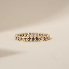 Timeless, elegant & dainty, this rich shade of blue will make you feel like royalty each time you gaze at your hand! This can be your vibrant and unique wedding band, yet also the perfect dainty ring to add a pop of color to your solid gold ring stack. This is a full eternity band surrounding the entire finger. Choose your metal and size, and we will make it custom for you. September's birthstone is a stunning ring to stack with your wedding ring! - Handmade - Solid Gold - Natural Blue Sapphire - Total Sapphire Carat Weight: 1 ctw for size 6.5 - Width of the Band: 2.5 mm - Height of the Band: 1.7 mm 🛠 Your Sarah Elise piece is handcrafted with care! Ready-to-ship items go out within 3 business days. Made-to-order pieces typically take 7-10 business days to create. If you need something so Bezel Eternity Band, Birthstone Wedding Ring, Sapphire Eternity Band, Sapphire Eternity Ring, Zierlicher Ring, Handmade Fine Jewelry, Unique Wedding Bands, Wedding Ring Set