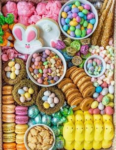 an assortment of candy, cookies and candies on a table with the words happy easter