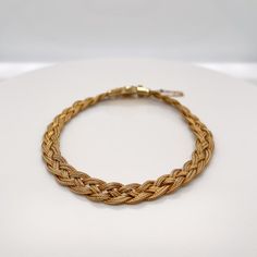 A very fine 14k gold Etruscan style bracelet.  With three delicate strands of woven braided gold wire terminating in an Etruscan style box clasp with granulated and wire work decoration.   Set with a safety chain.  Simply a finely-made Etruscan style bracelet!  Date: 20th Century  Overall Condition: It is in overall good, as-pictured, used estate condition with some very fine & light surface scratches and other signs of expected light wear consistent with age.  Fineness: Marked 14k for gold fine Style Box, Box Clasp, Safety Chain, Wire Work, Gold Wire, Fashion Bracelets, Vintage Antiques, 20th Century, Bracelet