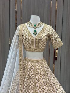 Be the center of attention on your special day with this beautiful 050- bridal set. Its timeless design and bold style will ensure that you look and feel your confident best as you walk down the aisle. Get ready for an unforgettable experience! Fabric: Raw Silk! WASH CARE INSTRUCTIONS - Please Dry clean only when it is applicable. Ready to Ship! Elegant Formal Lehenga With Pearl Embroidery, Gold Choli With Pearl Embroidery For Wedding, Gold Wedding Choli With Pearl Embroidery, Gold Lehenga With Pearl Embroidery For Wedding, Elegant Wedding Choli With Pearl Embroidery, Elegant Lehenga With Intricate Embroidery For Ceremony, Elegant Ceremony Lehenga With Intricate Embroidery, Traditional Formal Lehenga With Pearl Embroidery, Pink Luxury Gown For Wedding