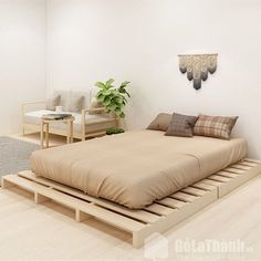 a bed sitting on top of a wooden platform