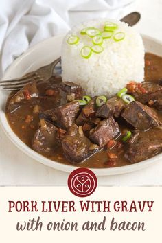 a white plate topped with meat and rice