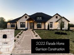 a house with the words, 2020 parade home garrison construction