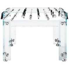 an acrylic console table with many different knobs and screws on it