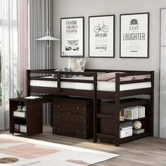 a loft bed with drawers underneath it in a living room next to a wall mounted poster