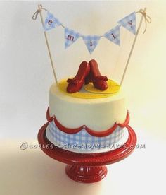 a cake decorated with red shoes and bunting