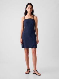 Soft linen-blend mini dress.  Square neck.  Spaghetti straps.  Zipper at back.  Fit: Slim.  A slim silhouette that fits close to the body.  Hits above the knee.  Model is approx.  5’10” wearing Denim Blue Dress, Long Blue Dress Casual, Spagetti Strap Dress, Linen Looks, Summer Shift Dress, Glamorous Fashion, Dress Square Neck, Designer Mini Dresses, Long Blue Dress