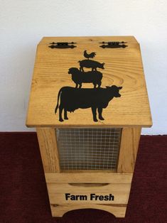 a wooden box with farm fresh design on the front and sides, sitting on a red carpeted floor