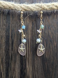 These adorable earrings were created with coral, freshwater pearls, faceted aqua glass beads, pink tumbled seaglass as well as a cute 14k Gold Filled starfish. All lovingly hung on 14k Gold Filled Chain and ear wires. Available in Sterling Silver as well. Can be custom created with different beads and wire just Convo me before purchasing. A great gift for a loved one or even for yourself❤️ Seaglass Jewelry, Beach Earrings, Aqua Glass, Ocean Jewelry, Sea Glass Earrings, Sea Glass Jewelry, Beads And Wire, Glass Earrings, Jewelry Diy