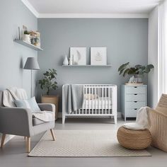 a baby's room with grey walls and white furniture