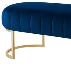 a blue velvet bench with gold legs on an isolated white background for use in interior design