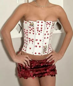 a woman wearing a corset with hearts on it