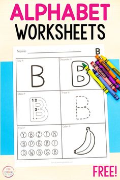 an alphabet worksheet with crayons and markers